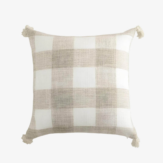 Coussin beige à rayures et pompons
