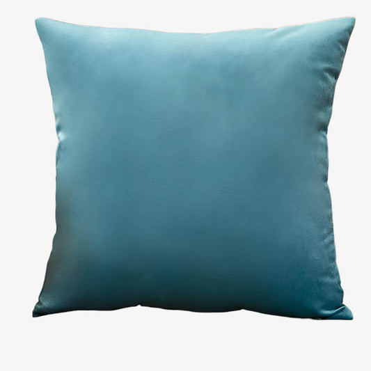 Coussin bleu en velours uni