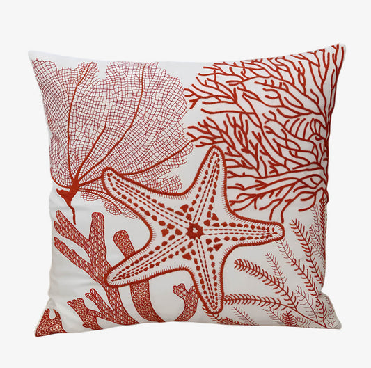Coussin brodé corail