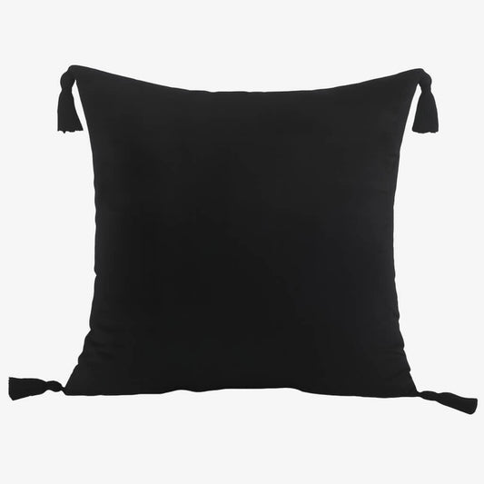 Coussin noir avec pompons